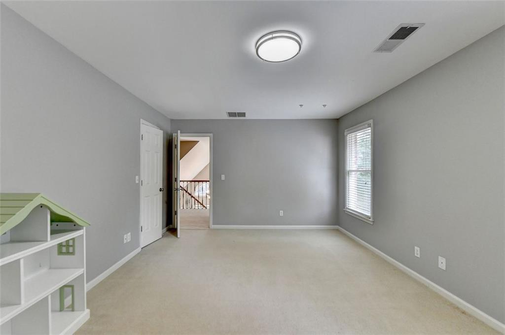 7830 Tintern Trace Duluth, GA 30097 - Photo 62 of 91 a view of an empty room with a window