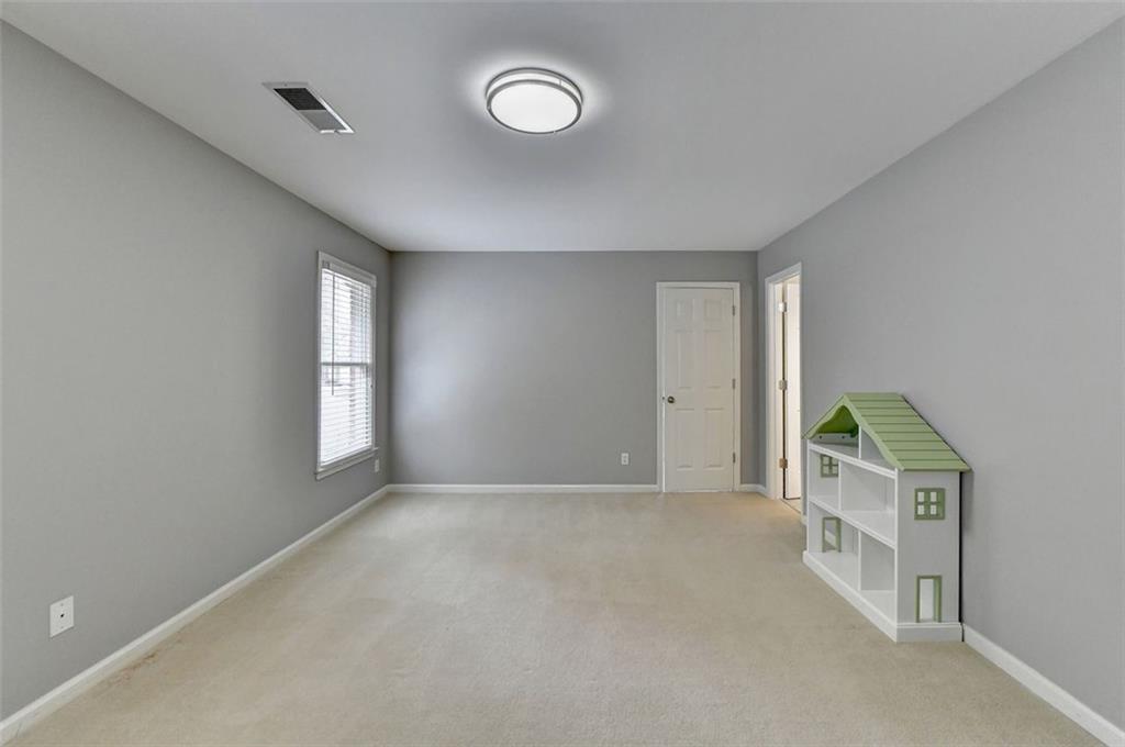 7830 Tintern Trace Duluth, GA 30097 - Photo 63 of 91 a view of an empty room with a window