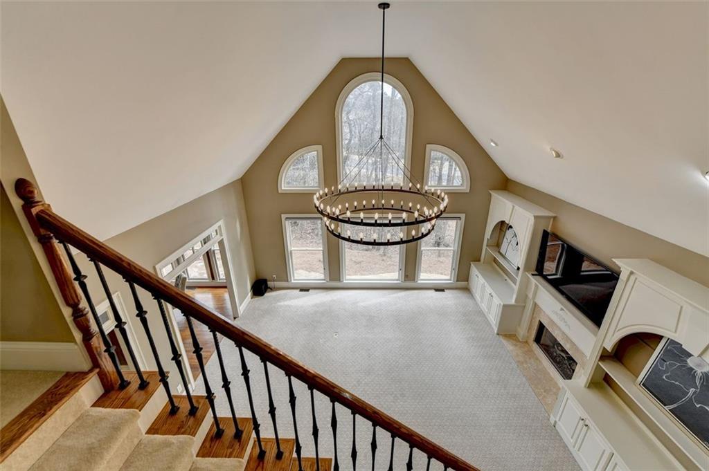 7830 Tintern Trace Duluth, GA 30097 - Photo 66 of 91 a view of a hallway with entryway wooden floor and front door