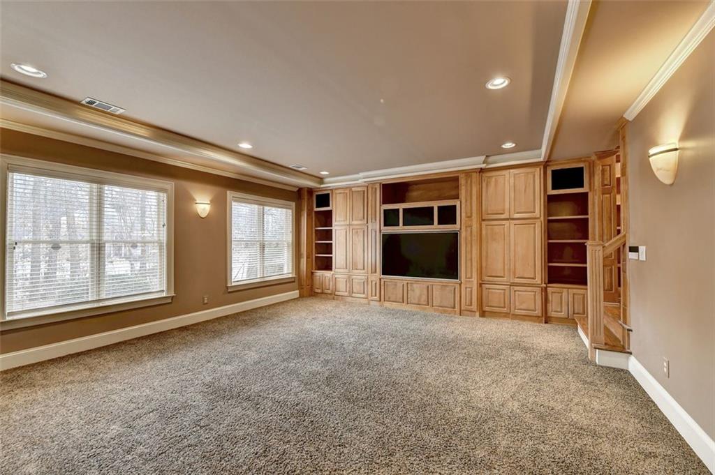 7830 Tintern Trace Duluth, GA 30097 - Photo 73 of 91 a view of an empty room with a window and storage