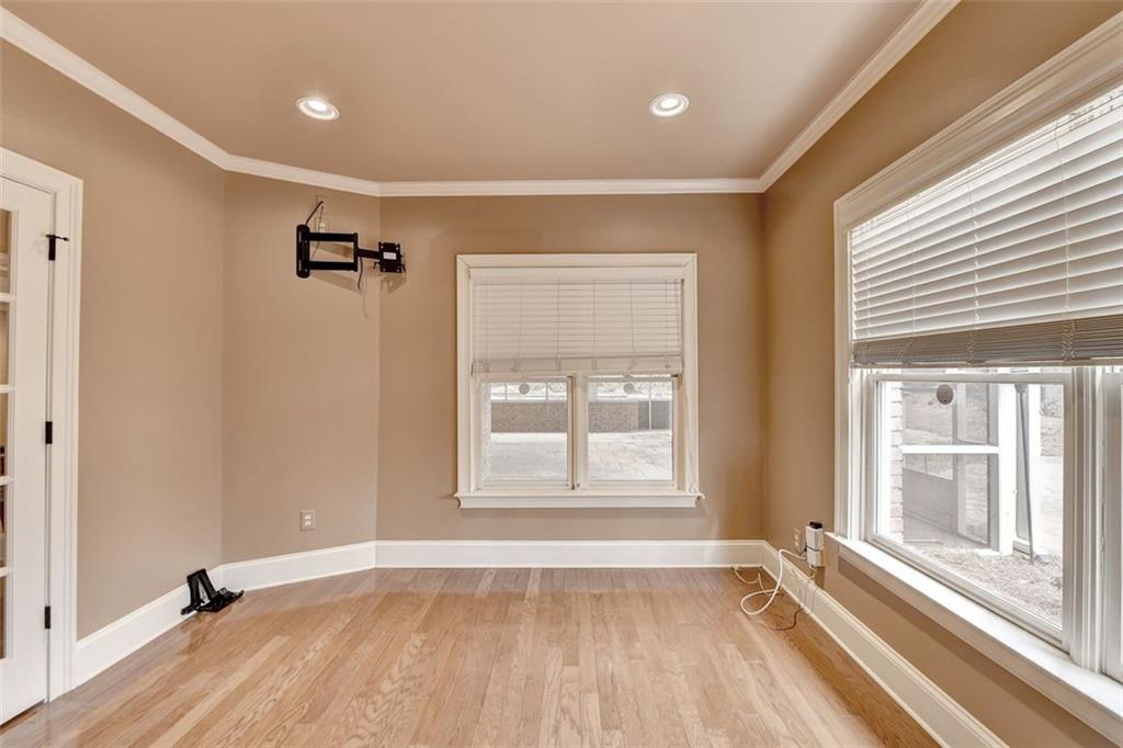 7830 Tintern Trace Duluth, GA 30097 - Photo 85 of 91 a view of an empty room with a window and wooden floor