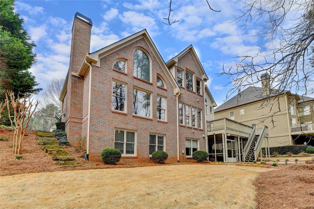 7830 Tintern Trace Duluth, GA 30097 - Photo 89 of 91 a front view of a building with a yard