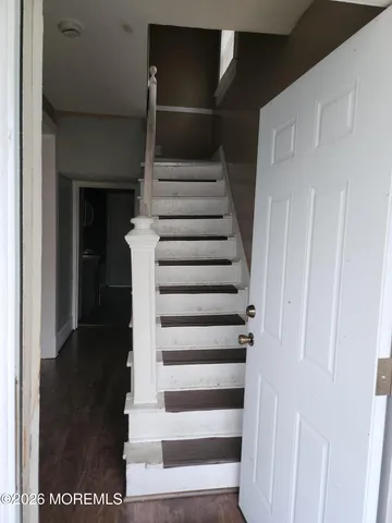 a view of entryway with wooden floor