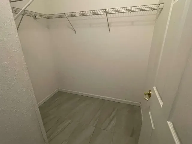 a view of a room with racks on the wall