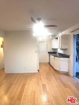 a view of kitchen with wooden floor