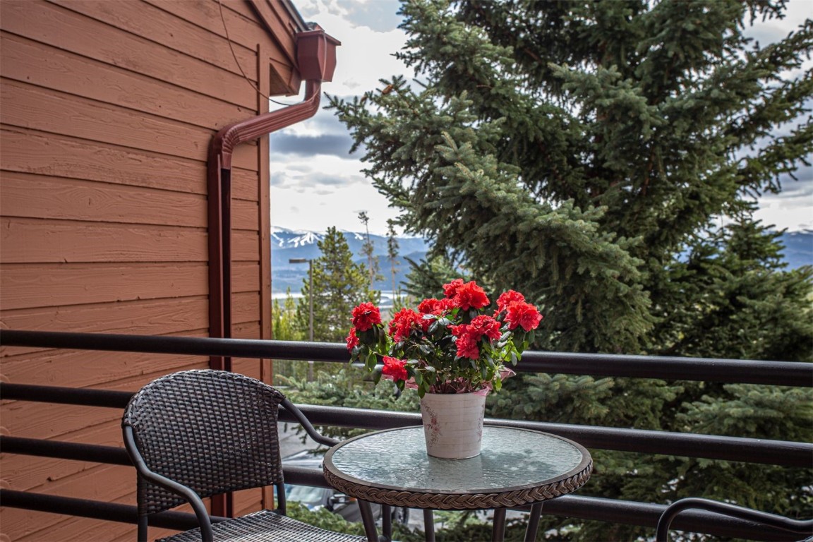 91400 Ryan Gulch Road, Unit 419 Silverthorne, CO 80498 - Photo 12 of 34 a view of a chair and table in the balcony