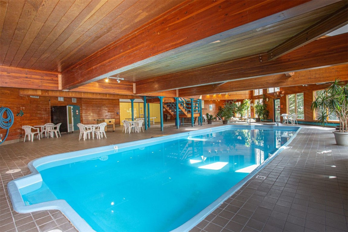 91400 Ryan Gulch Road, Unit 419 Silverthorne, CO 80498 - Photo 23 of 34 a view of a swimming pool with a patio