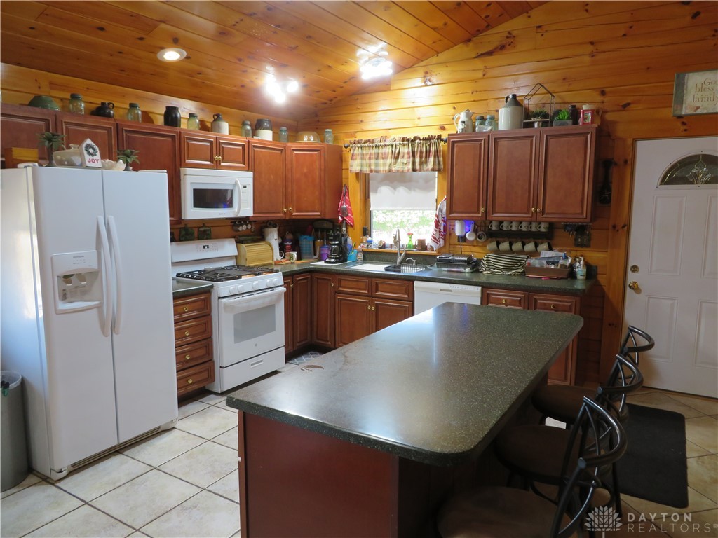 748 Inlow Avenue Peebles, OH 45660 - Photo 14 of 61 This spacious kitchen offers a functional layout with ample counter space.