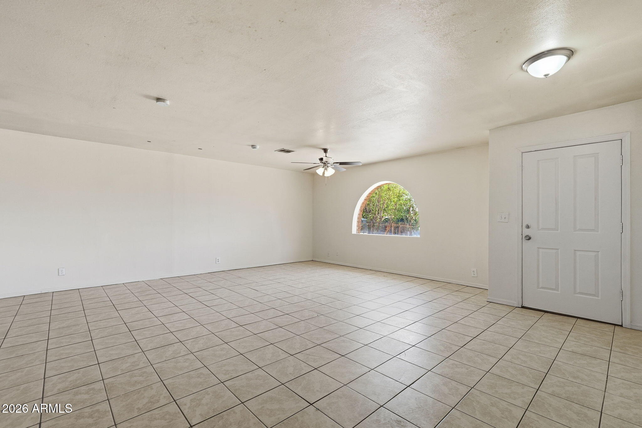 6452 West Thomas Road Phoenix, AZ 85033 - Photo 3 of 30 an empty room with windows