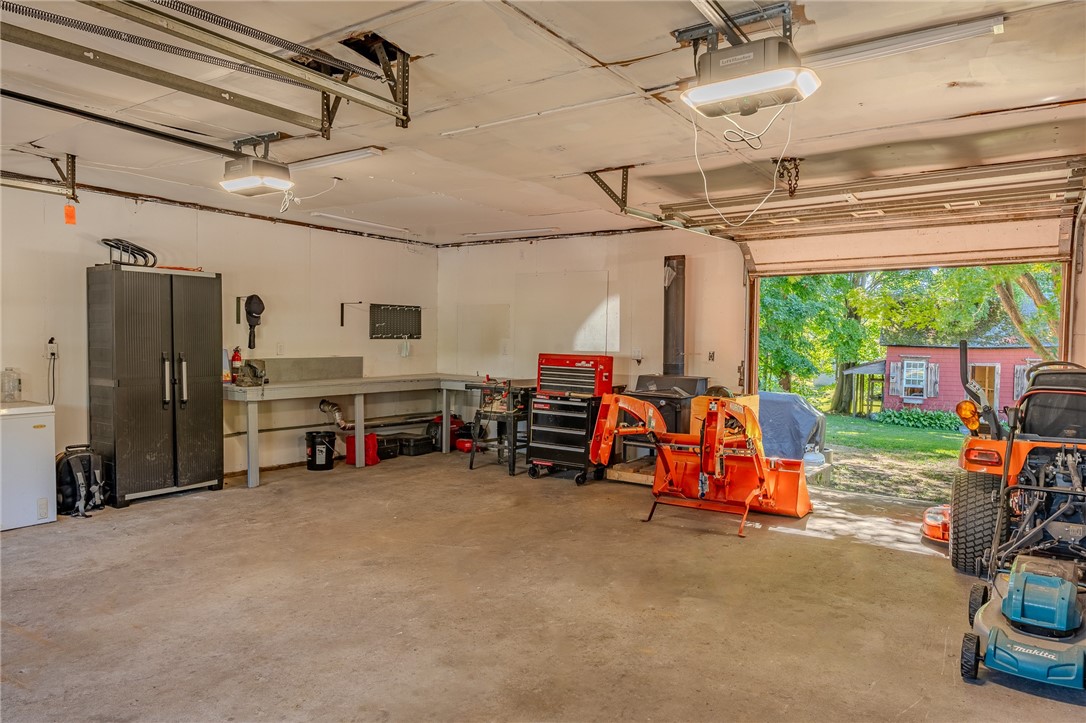726 Washington Street Coventry, RI 02816 - Photo 37 of 45 Workbench area and garage door opening to patio