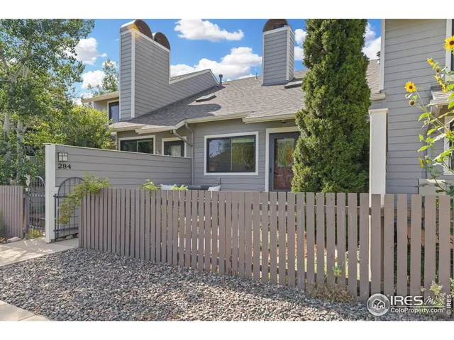 a side view of a house with a garden
