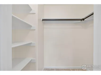 a view of an empty walk in closet