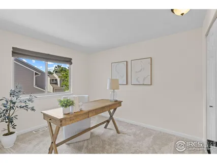 a living room with furniture and window