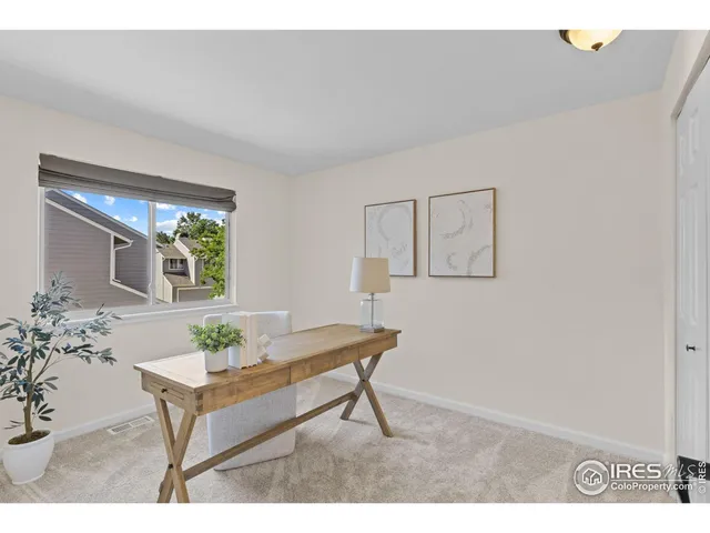 a living room with furniture and window