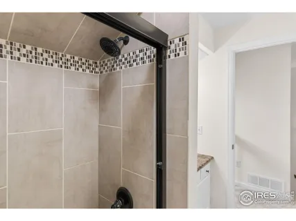 a bedroom with a bed and a potted plant