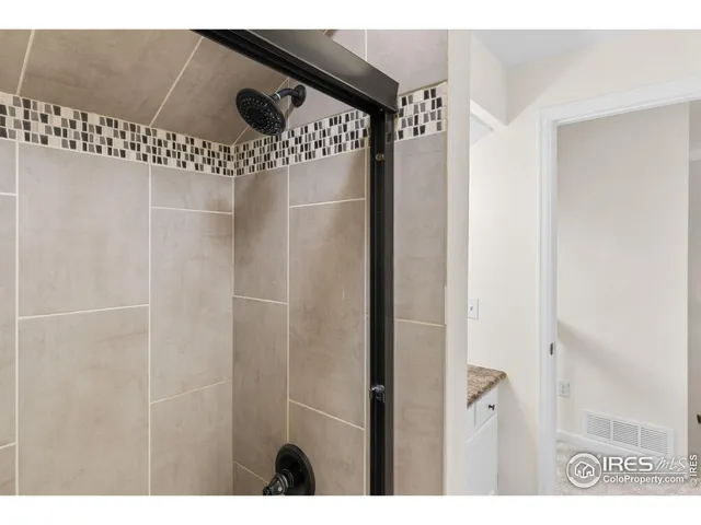 a bedroom with a bed and a potted plant