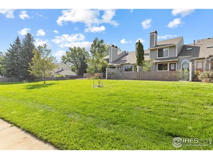 a view of a building with a big yard