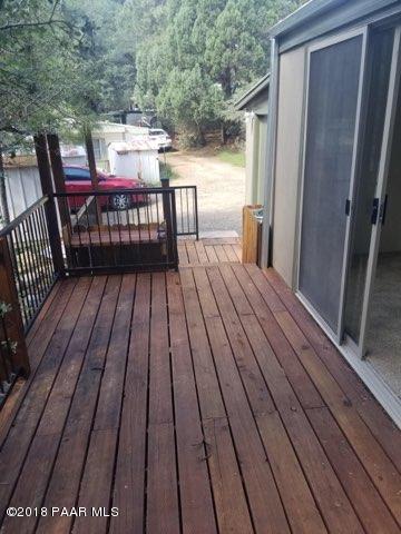 1520 White Spar Road Prescott, AZ 86303 - Photo 15 of 20 a view of a balcony with wooden floor and outdoor seating