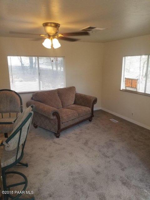 1520 White Spar Road Prescott, AZ 86303 - Photo 17 of 20 a living room with furniture and a large window