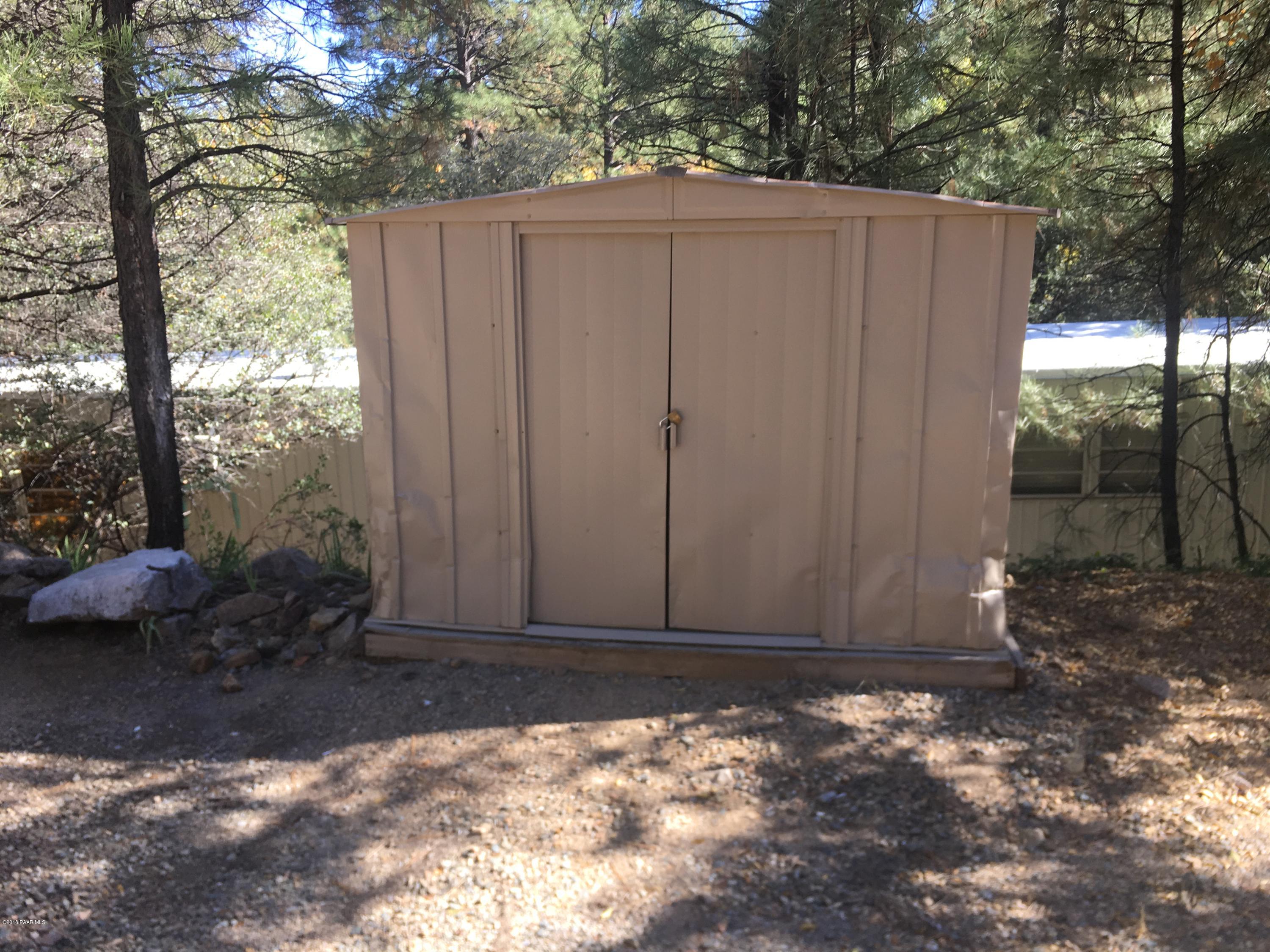 1520 White Spar Road Prescott, AZ 86303 - Photo 5 of 20 a view of a wooden door in the backyard