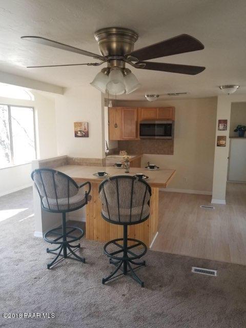 1520 White Spar Road Prescott, AZ 86303 - Photo 8 of 20 a view of a workspace with furniture and a window