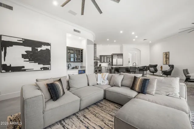a view of living room kitchen with a couch and a view of living room