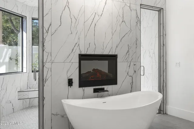 a bathroom with a bathtub and a sink