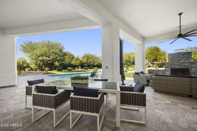 a outdoor living space with furniture and a floor to ceiling window