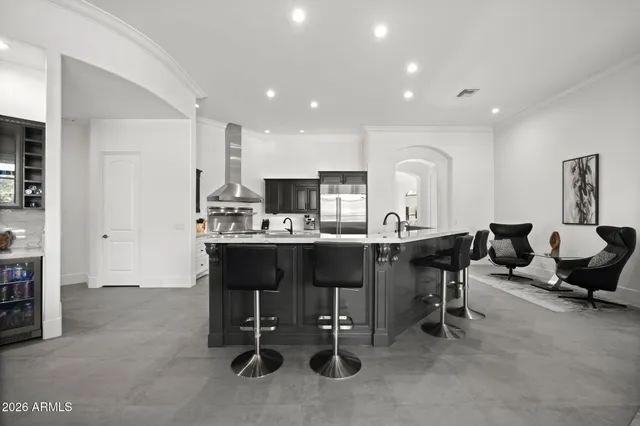 a living room with furniture a dining table and kitchen view