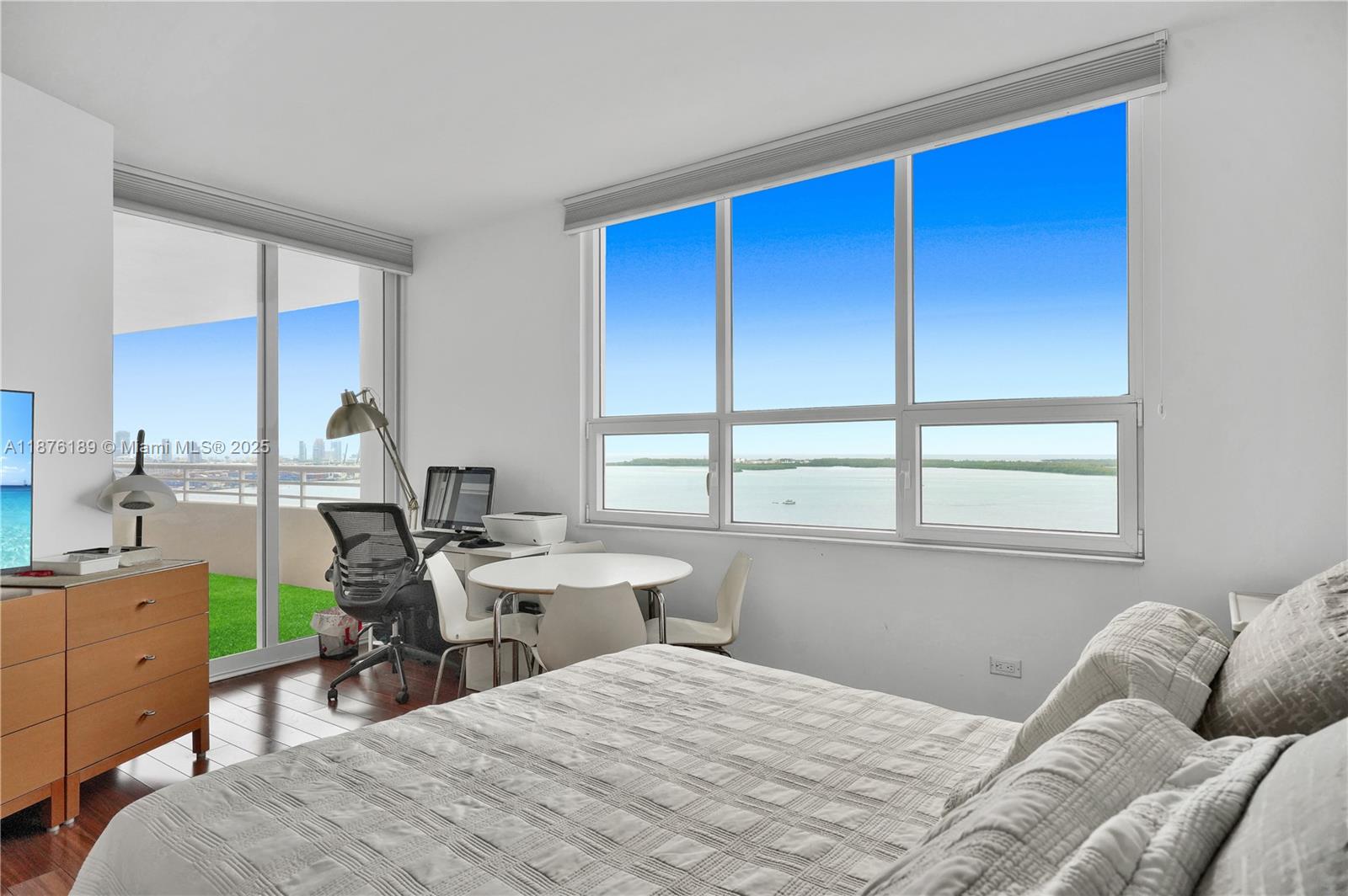 808 Brickell Key Drive, Unit 2506 Miami, FL 33131 - Photo 14 of 30 a bedroom with a bed and a window