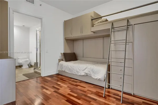a bedroom with a bed and a walk in closet
