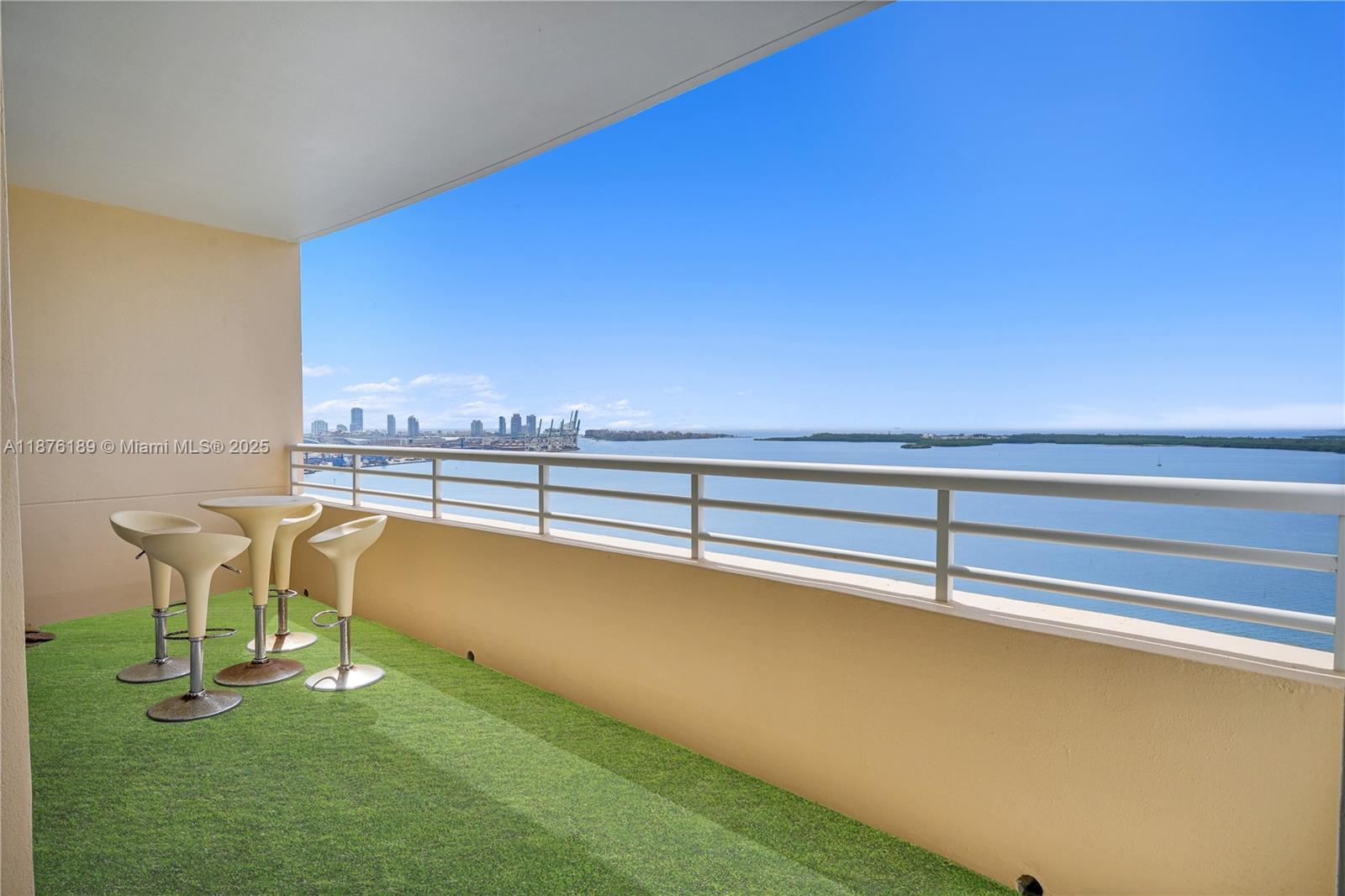 808 Brickell Key Drive, Unit 2506 Miami, FL 33131 - Photo 28 of 30 a view of a swimming pool with lawn chairs