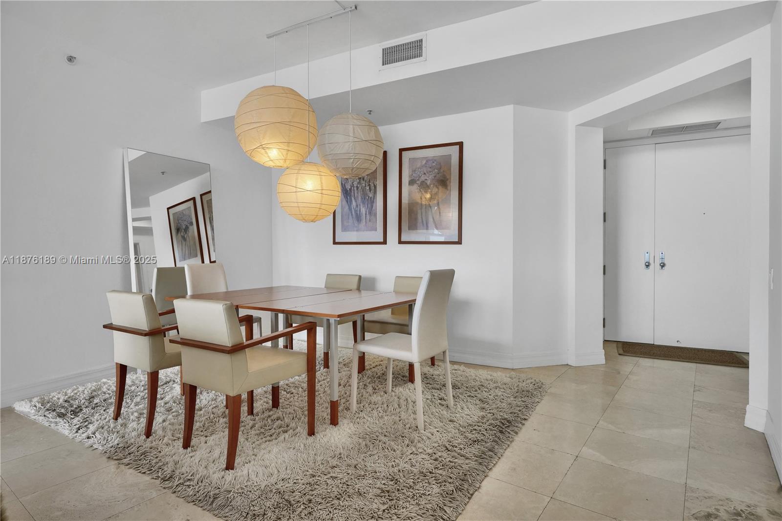 808 Brickell Key Drive, Unit 2506 Miami, FL 33131 - Photo 7 of 30 a view of a dining room with furniture