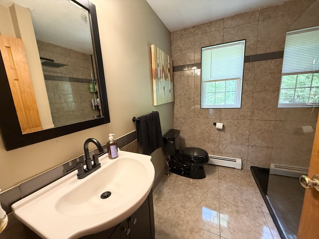 222 Bridge Street Warren, MA 01083 - Photo 20 of 40 a bathroom with a sink and a mirror