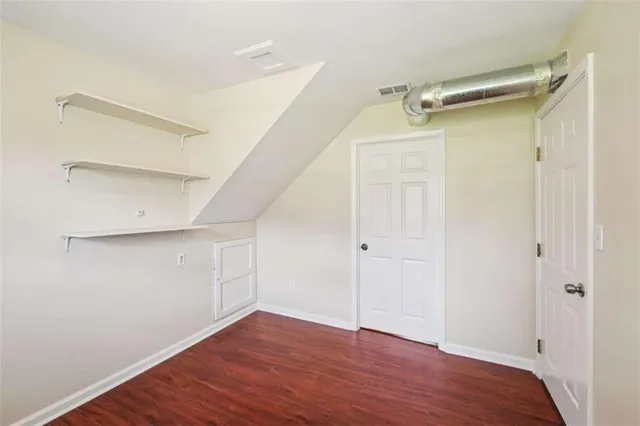 a view of an empty walk in closet