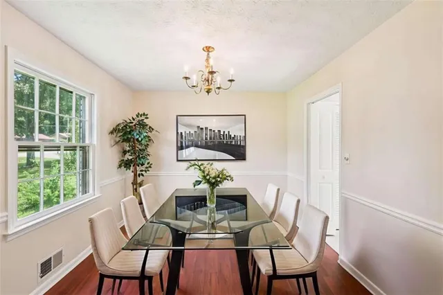 a view of a dining room with furniture window and outside view