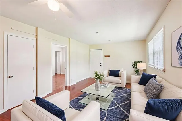 a living room with furniture and a table