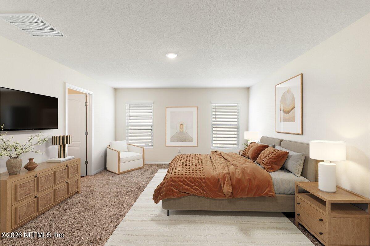 233 Falcon Ridge Road St. Augustine, FL 32084 - Photo 12 of 34 a bedroom with bed and flat screen tv