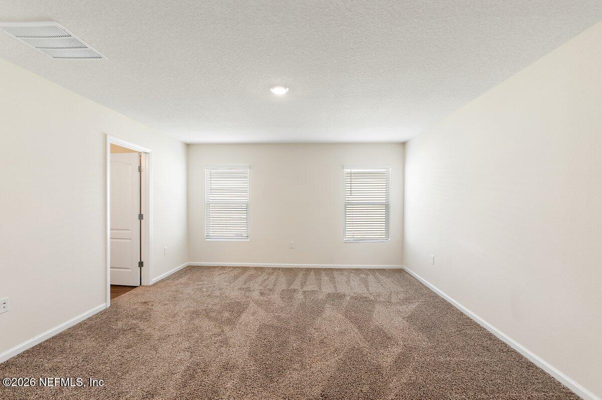233 Falcon Ridge Road St. Augustine, FL 32084 - Photo 13 of 34 a view of room and window