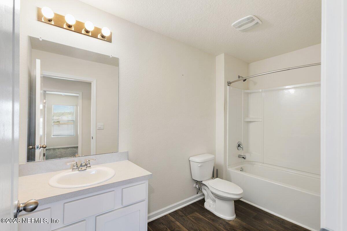 233 Falcon Ridge Road St. Augustine, FL 32084 - Photo 20 of 34 a bathroom with a sink a toilet and shower
