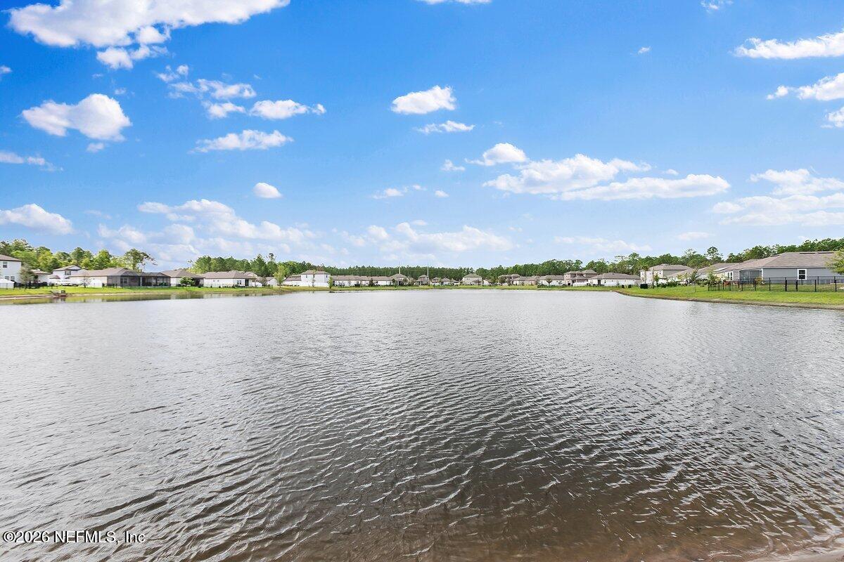 233 Falcon Ridge Road St. Augustine, FL 32084 - Photo 23 of 34 a view of a lake with a lake