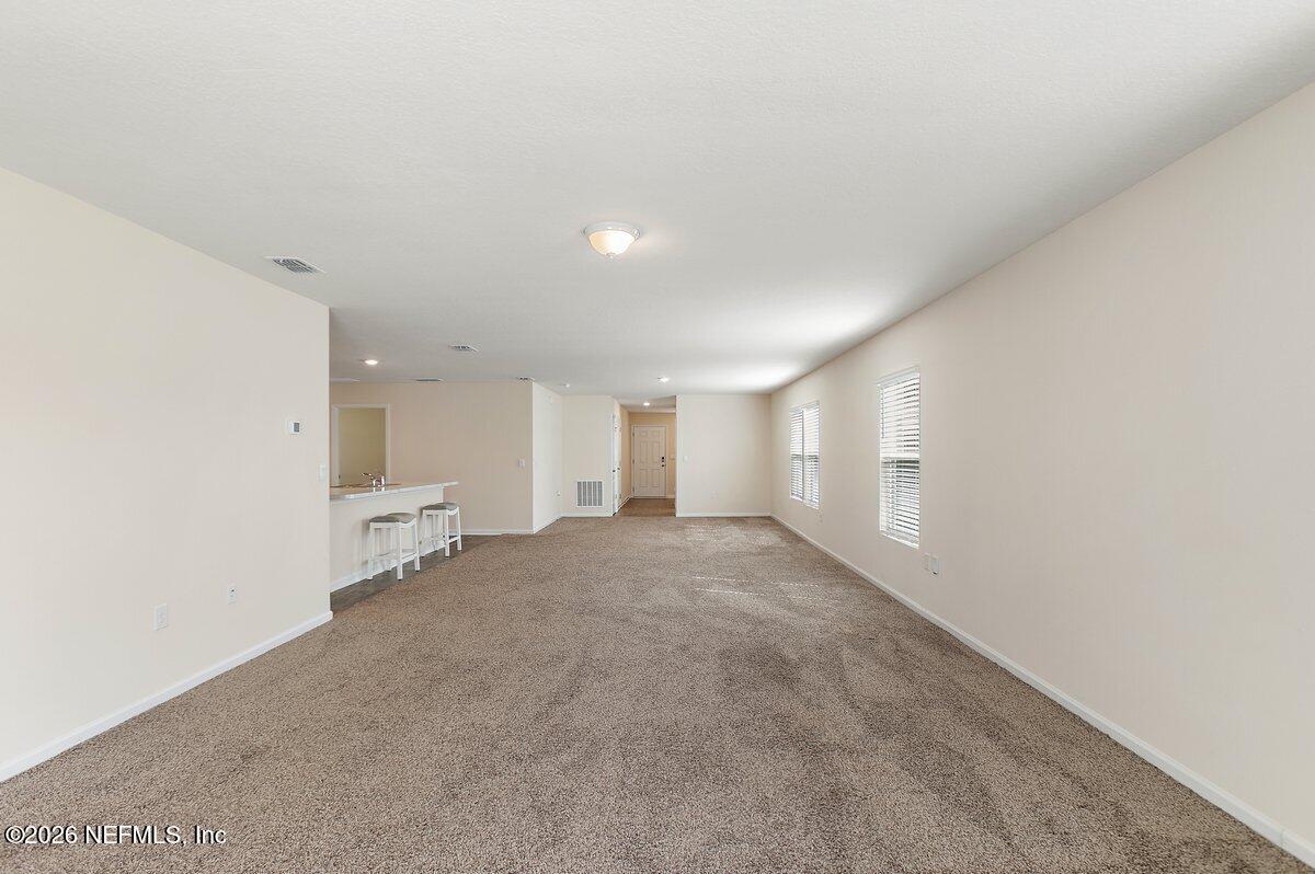233 Falcon Ridge Road St. Augustine, FL 32084 - Photo 7 of 34 a view of a room with an empty space