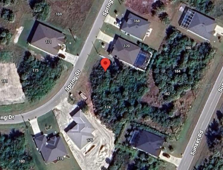 172 Spring Drive Rotonda West, FL 33947 - Photo 2 of 3 an aerial view of a house