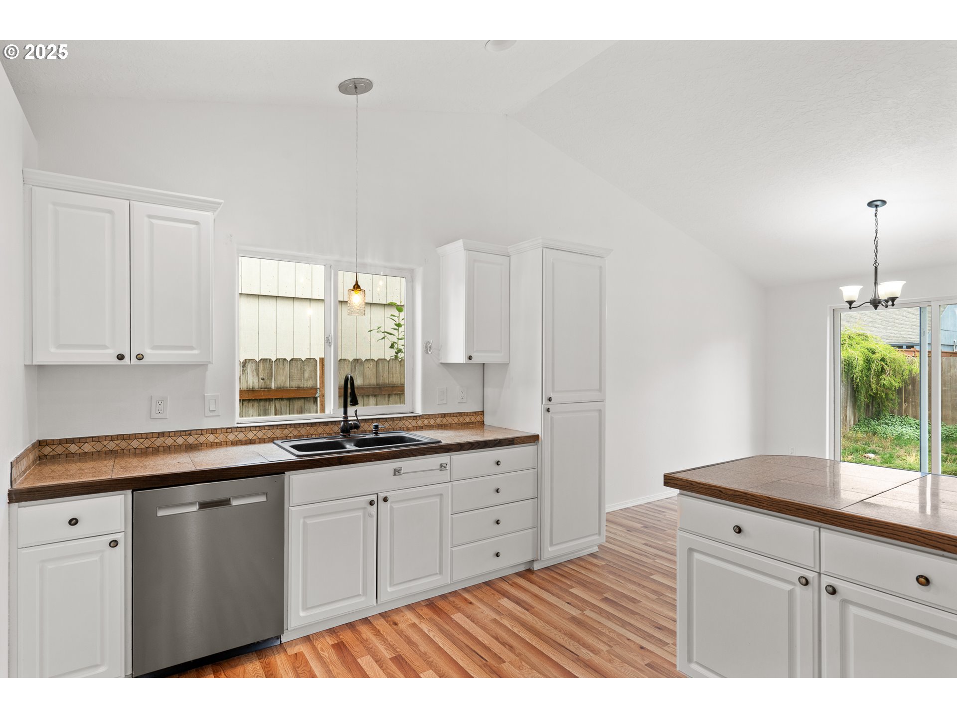 1237 South 7th Street Independence, OR 97351 - Photo 12 of 29 a kitchen with granite countertop a sink and cabinets