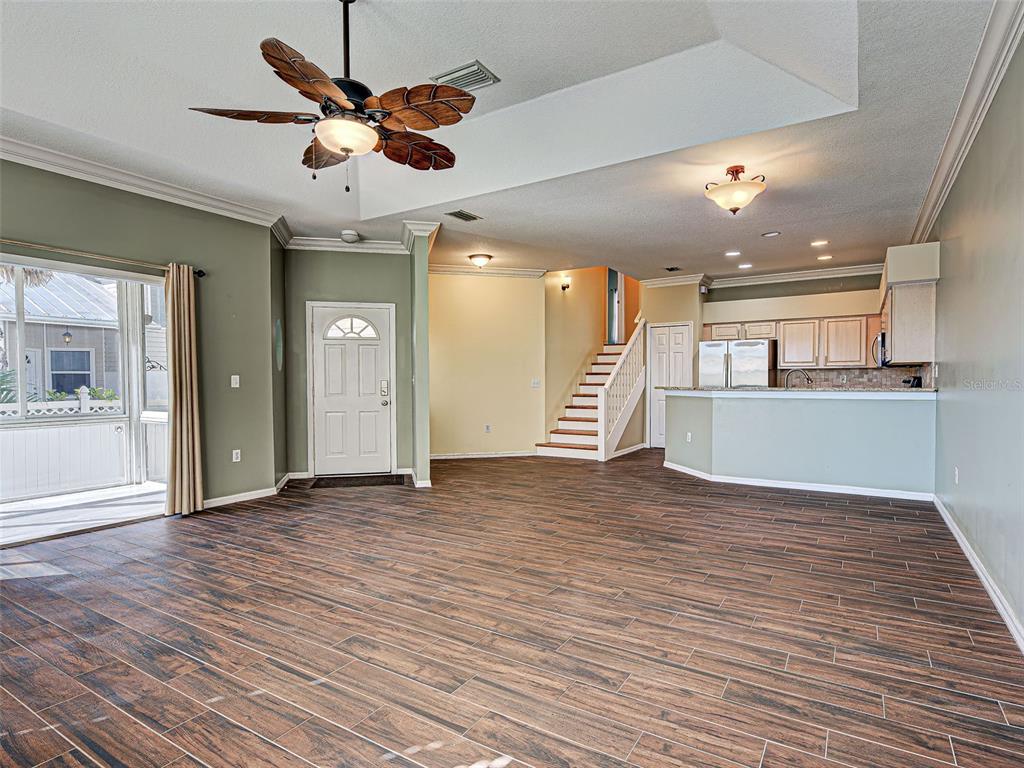 1801 Highland Road Osprey, FL 34229 - Photo 9 of 40 an empty room with wooden floor and windows