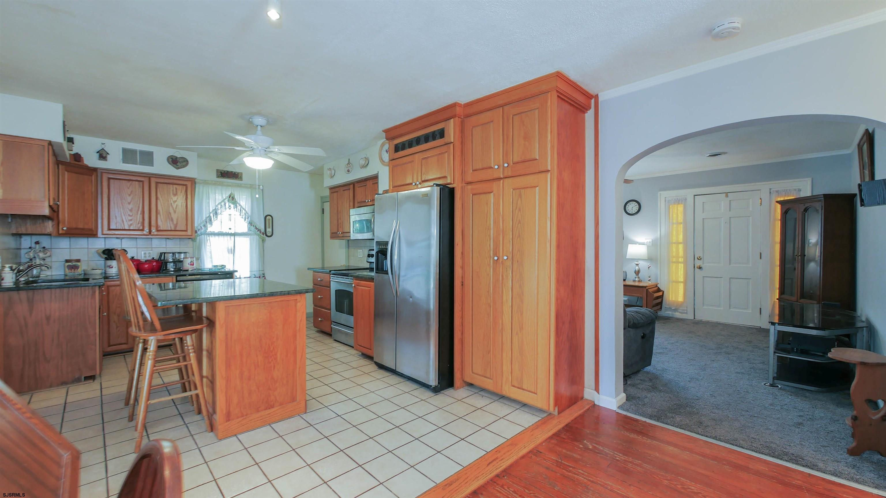 346 Tuckahoe Road Vineland, NJ 08360 - Photo 16 of 44 a kitchen with stainless steel appliances granite countertop a refrigerator and a sink