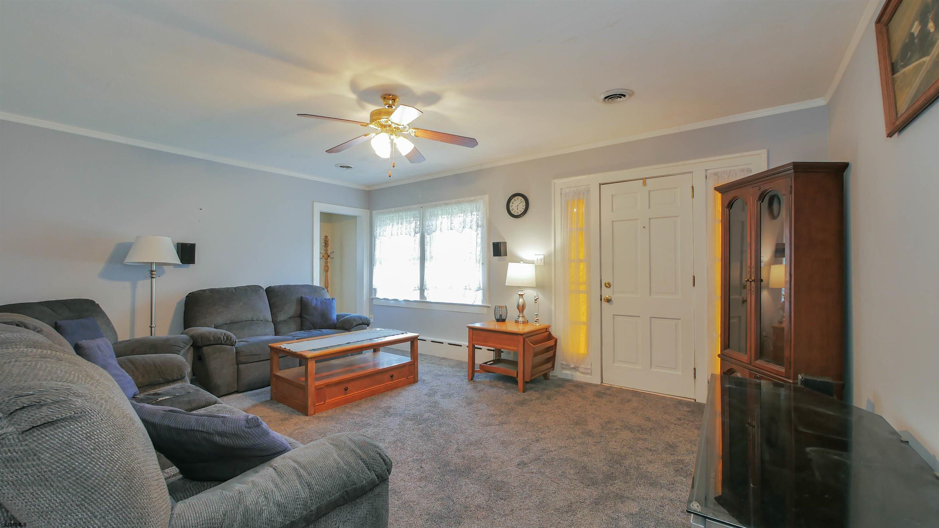 346 Tuckahoe Road Vineland, NJ 08360 - Photo 17 of 44 a living room with furniture and a chandelier