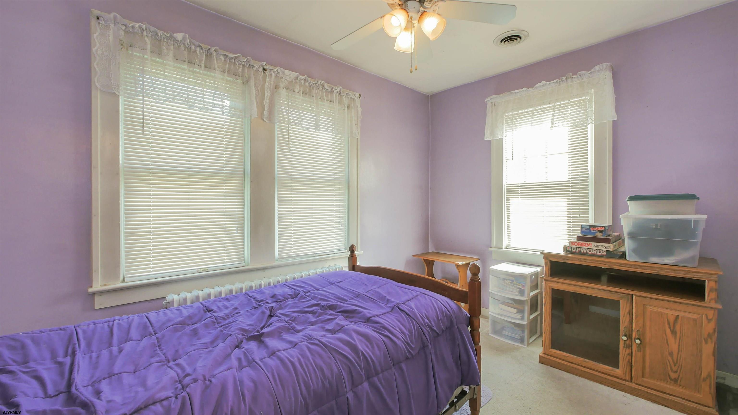 346 Tuckahoe Road Vineland, NJ 08360 - Photo 21 of 44 a bedroom with a bed and a dresser next to a window