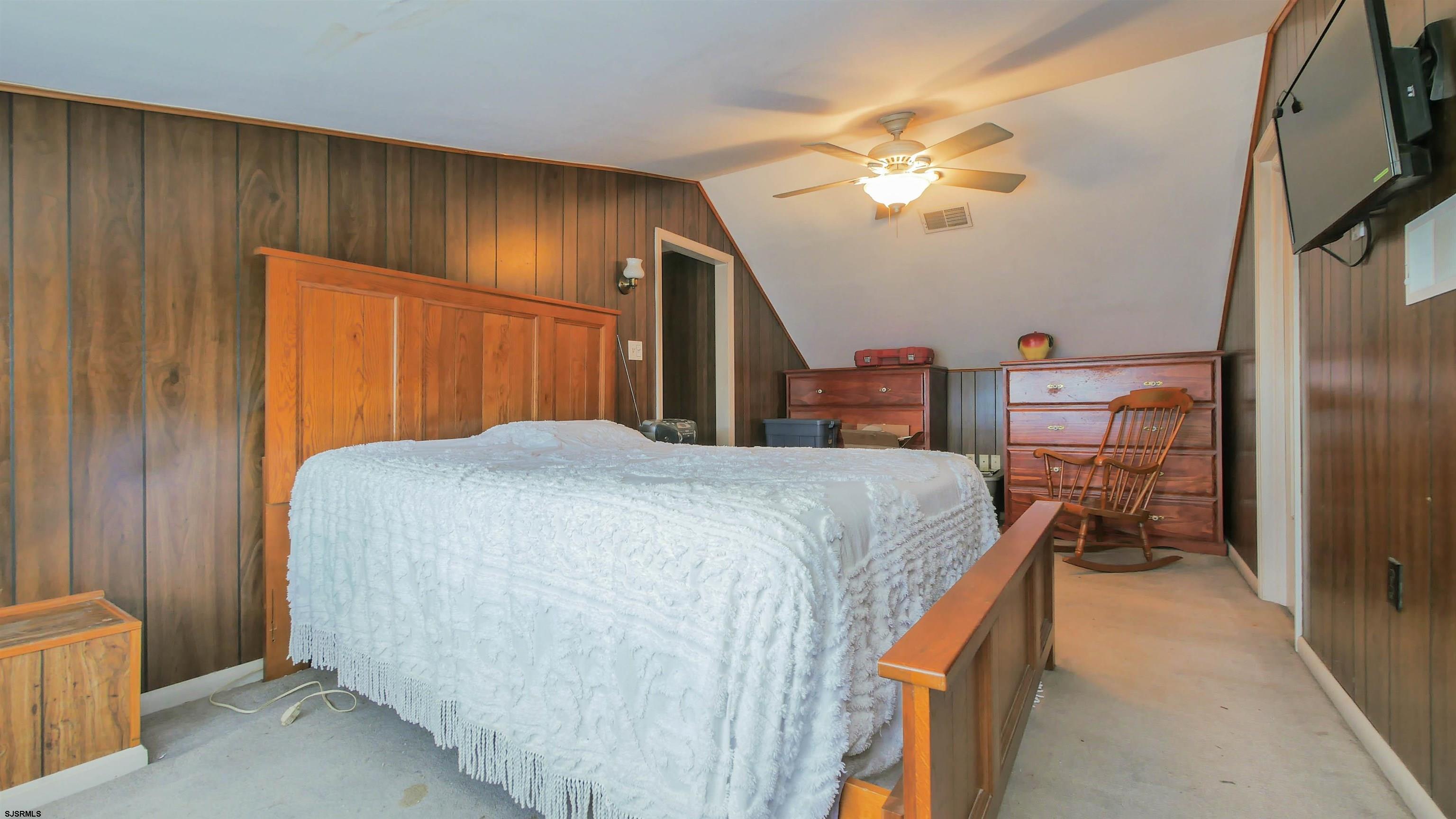 346 Tuckahoe Road Vineland, NJ 08360 - Photo 24 of 44 a bedroom with a bed and a chandelier