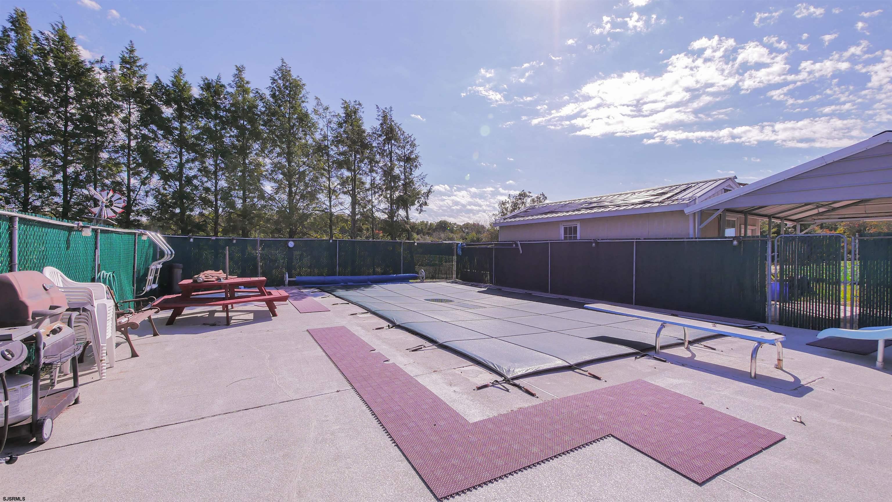 346 Tuckahoe Road Vineland, NJ 08360 - Photo 34 of 44 a backyard of a house with table and chairs